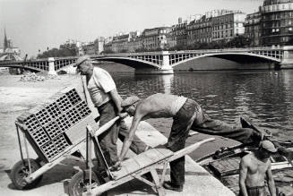 Workers Loading Carts along the Seine