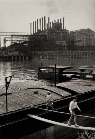 Untitled (Two Children on Edge of a Barge and Plank with a River and Factory in the Background)