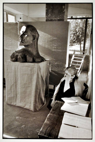 Untitled (Seated Woman with Guest Book and Sculpted Portrait of Lenin)