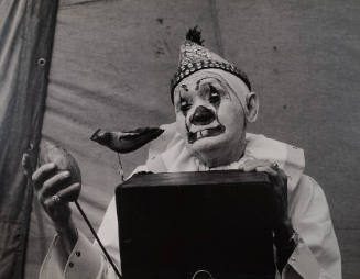 Millers Bros. Circus, St. Louis, MO. (clown, with football and bird)
