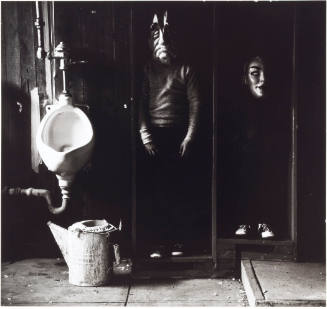 Untitled [Two children in masks and urinal]