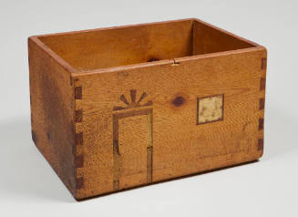 Small wooden storage box: unfinished HCW sculpture of a house (with inlaid door and window details) reused by HCW to store small wooden samples in studio
