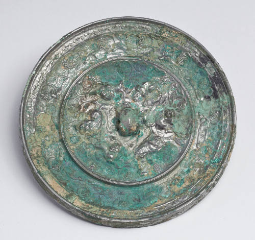 Mirror with Lion and Grapevine Motif