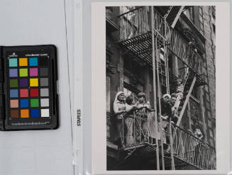 Family on fire escape, Lower East Side, New York City