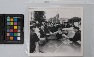 A woman was pulled from the hood of a Federal Bureau of Investigation automobile during an antiwar demonstration yesterday near the Untied States Supreme Court Building in Washington. The demonstration, which included burning of draft cards, was staged by a group of women pacificits. Two persons were arrested, June 18, 1968