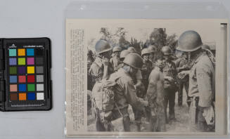 Flushed From The Swamp: South Vietnamese soldiers bind a Vietcong guerrilla preparatory to questioning after he was flushed from a Mekong River Delta swamp 120 miles southwest of Saigon on August 17, 1966. Troops of the 9th division, borne by U.S. Helicopters, were on a search and destroy operation when they located some guerrillas who were trying to hide their weapons in the swamp