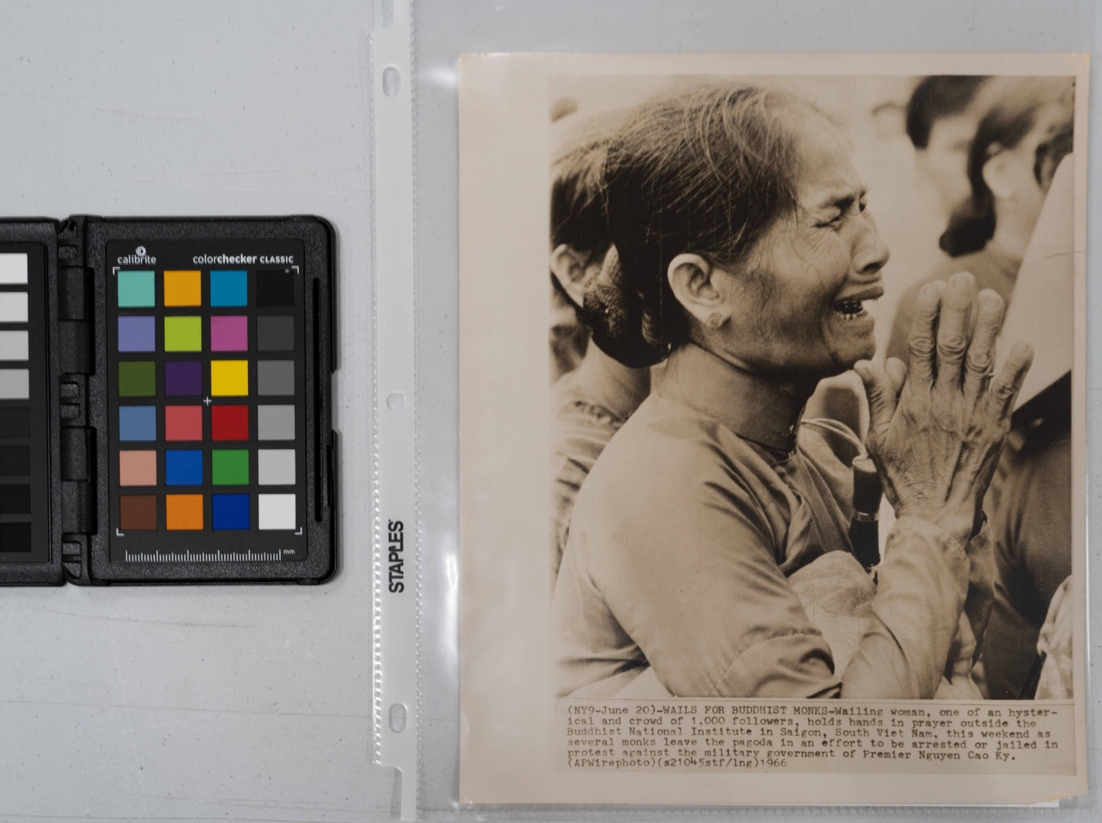 Wails for Buddhist Monks: Wailing woman, one of a crowd of 1,000 followers, holds her hands in prayer outside the Buddhist National Institute in Saigon, South Vietnam, June 18th, 1966, as several monks leave the pagoda in an effort to be arrested or jailed in protest against the military government of Premier Nguyen Cao Ky