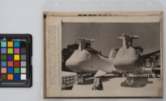 Lineup For Long Ride: passing Vietnamese views American troops resting in shade of mothballed Marine helicopters at dock area of Da Nang. Craft belong to Marine Air Group-16, first deployed in Vietnam in 1962, this is moving to Hawaii and California, May 29, 1971