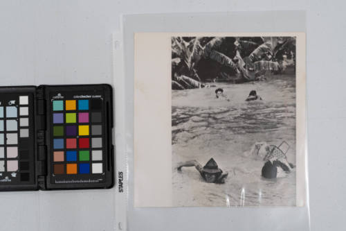 Villagers from a hamlet near Nathrang, central Vietnam, swam for their lives toward a rescue boat as new floods hit the area. Some of the villagers towed their belongings. The new floods caused some 500 deaths and left thousands homeless in Ninh Thuan and Phu Yen, December 1964