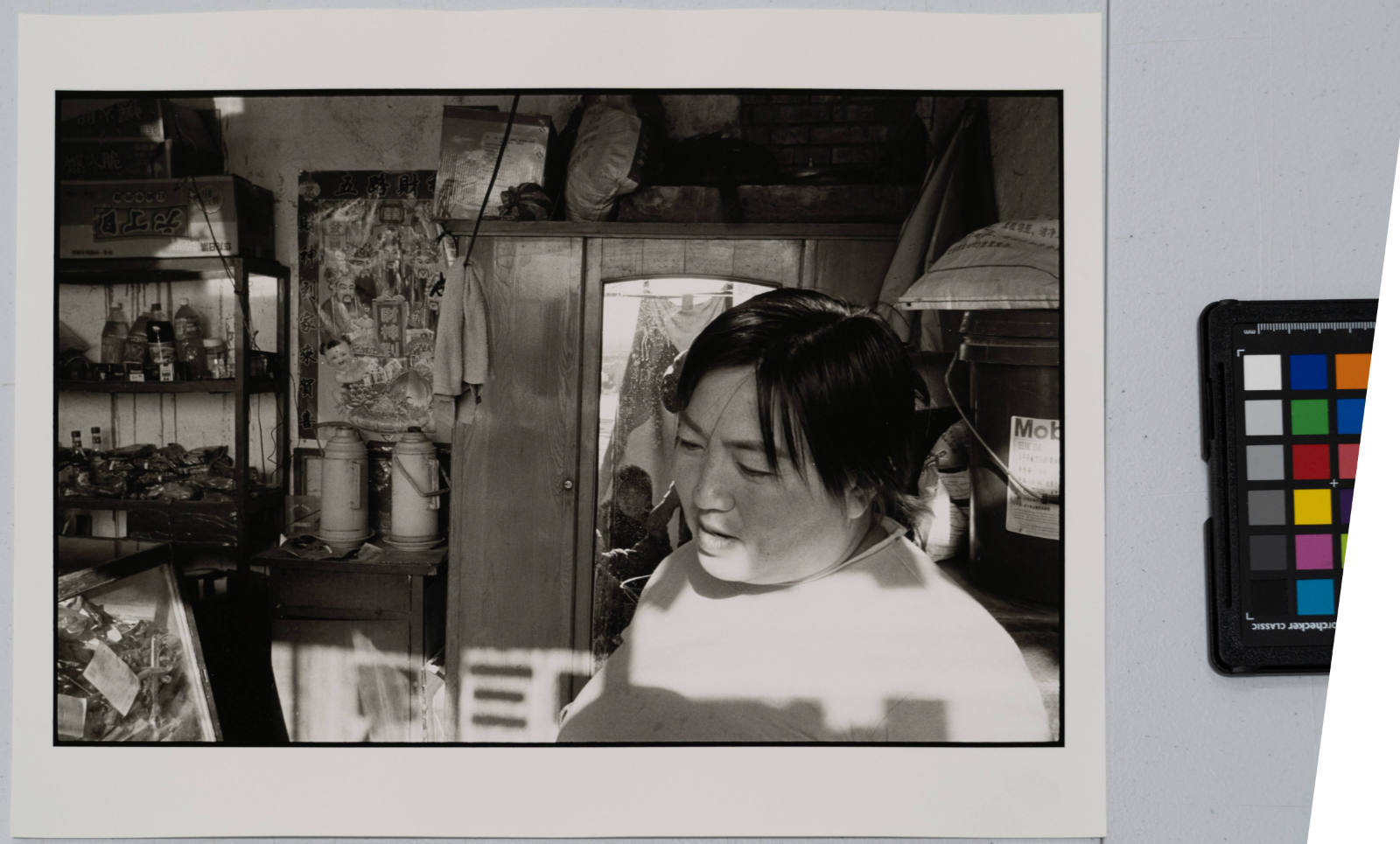 Woman in her store in an ancient village, China