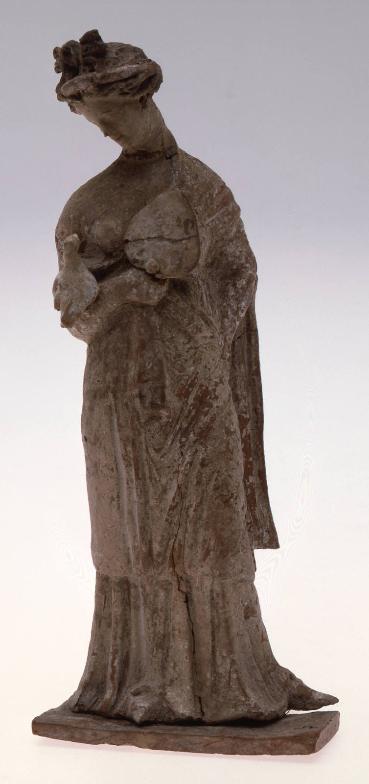 Standing Female Holding a Bird and Fan